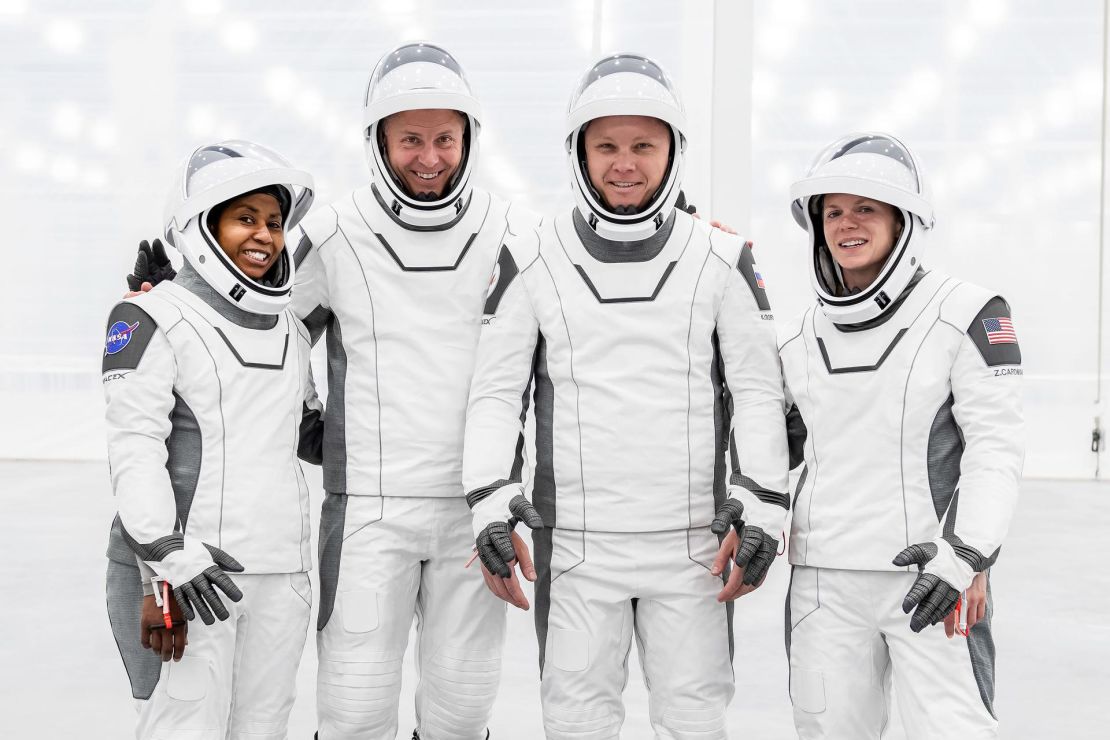 The original crew of NASA's SpaceX Crew-9 mission to the International Space Station - including (from left) Stephanie Wilson, Nick Hague, Aleksandr Gorbunov of Roscosmos and Zena Cardman - pose in their flight suits for a group photo during the modernization of SpaceX's new Dragon facility at the Kennedy Space Center in Florida. Cardman and Wilson lost their spots on the mission to make room for Suni Williams and Butch Wilmore.