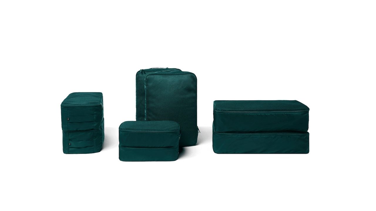 A photo of the July Packing Cubes in the green color way