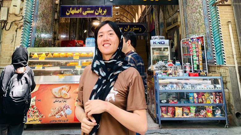 Kang in front of a mosque in Iran