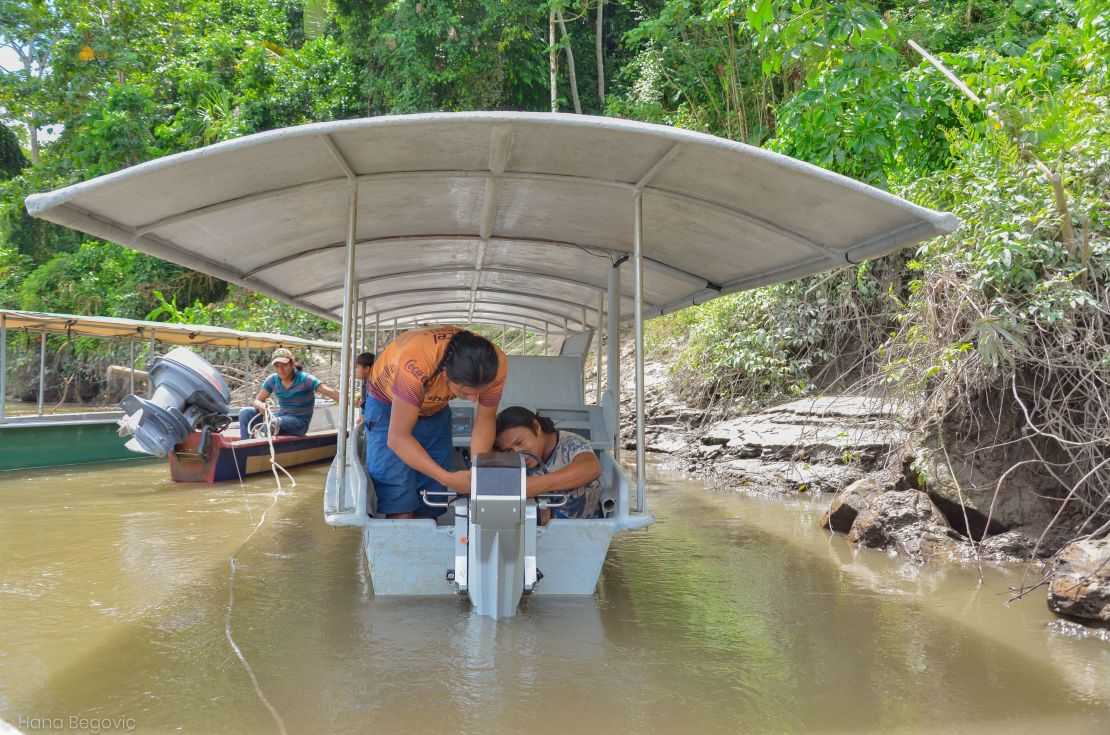 Achuar technicians maintaining the solar boats.