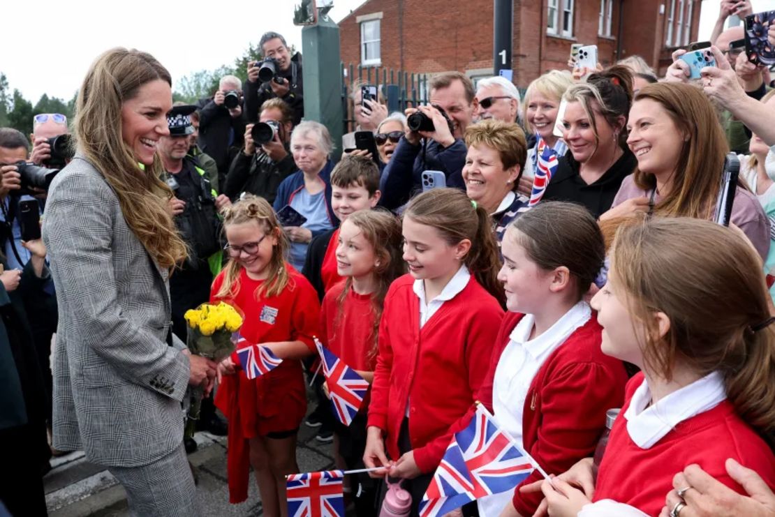 Catherine, Princess of Wales, greets children in Sudbury, Suffolk, Britain, on 11 September, during a tour of British textile manufacturers.