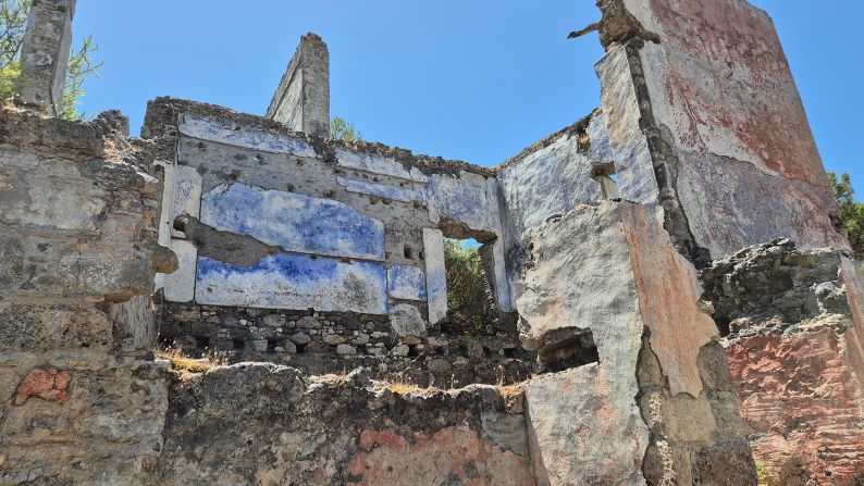 <strong>Feeling blue: </strong>Aysun Ekiz says relocated Turkish people didn't like the blue wall paint used by Karak?y's previous occupants to ward off scorpions. Others say the town's tragic past put them off living there.