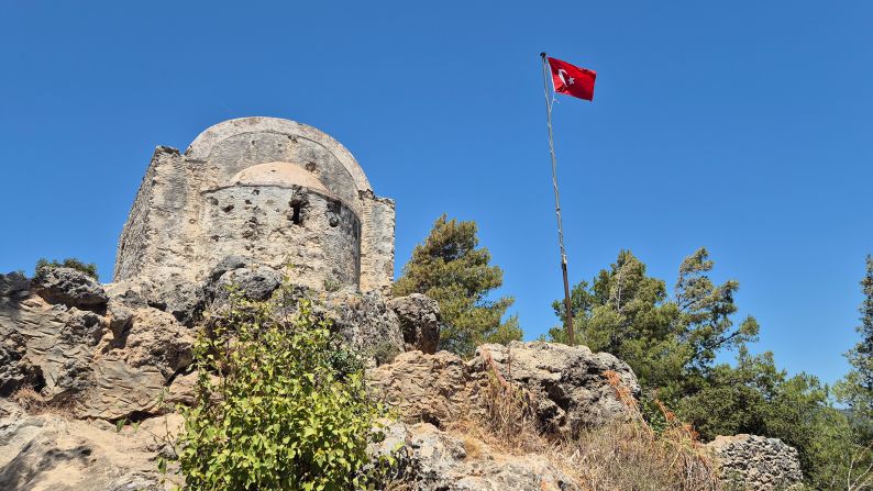 <strong>Church on the hill: </strong>An old Greek-style little church sits high on one of the hills, with a Turkish flag flying overhead.