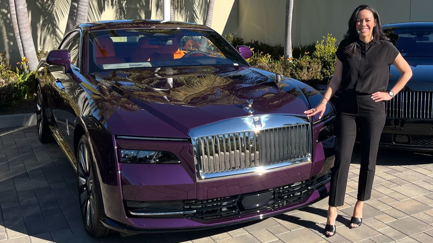 Kellyn Dixon, manager of a Rolls-Royce dealership in Irvine, California, is pictured January 31, 2024, with a custom-colored Rolls-Royce Spectre.