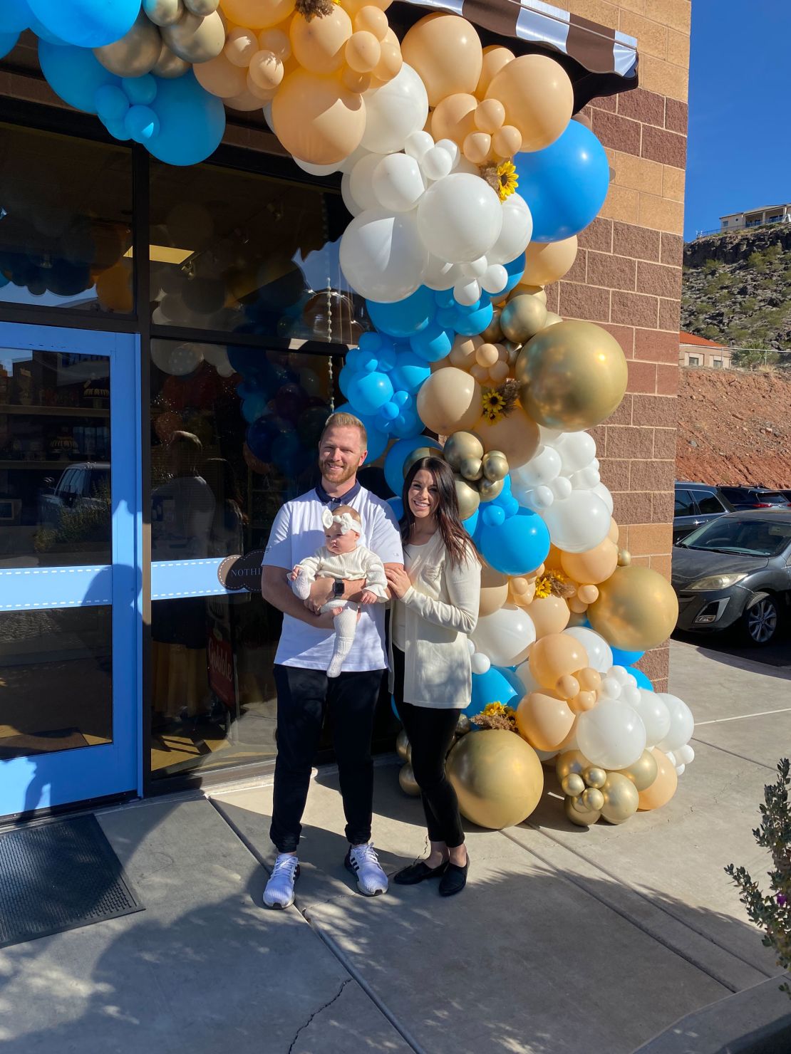 Kelsey Hunt and her family in 2021 outside their Nothing Bundt Cakes location in St. George, Utah.