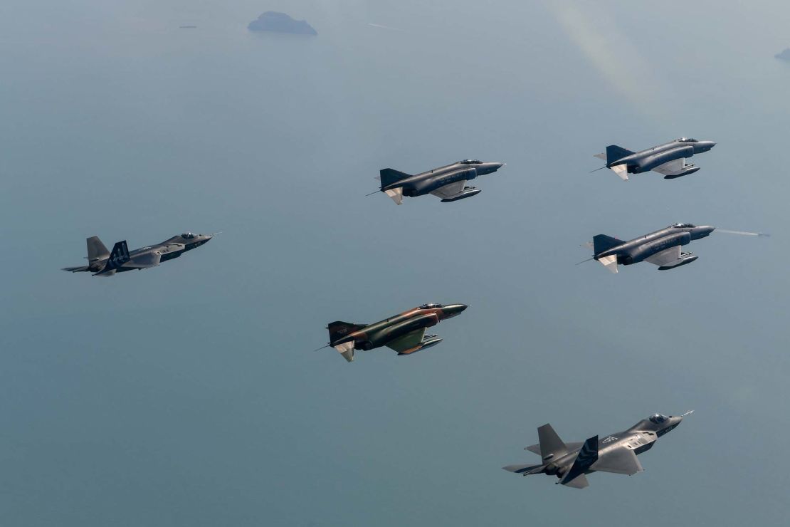 South?Korean?Air Force F-4s flying in formation with two KF-21 fighter jet prototypes over southern South Korea on May 8, 2024.