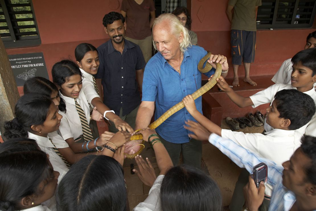 Romulus Whitaker teaches the next generation about reptiles at his conservation organization, Agumbe Rainforest Research Station, in southern India.