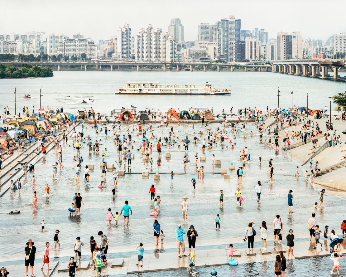 Unwinding at a water playground in Seoul's Mulbit Square.