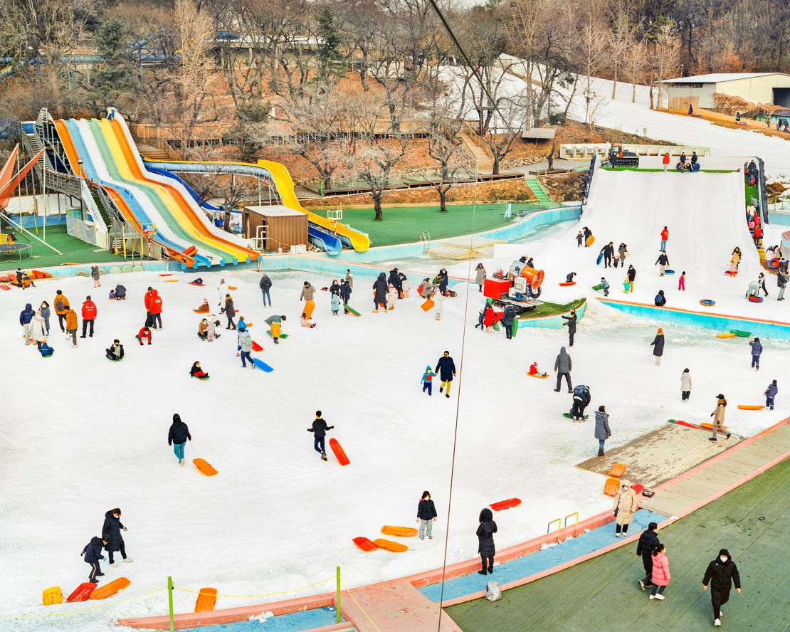 Sledders enjoy the snowy conditions in Seoul.