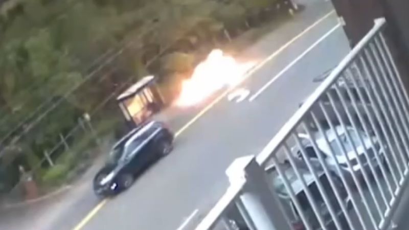 Surveillance video shows moment family narrowly escapes roadside explosion