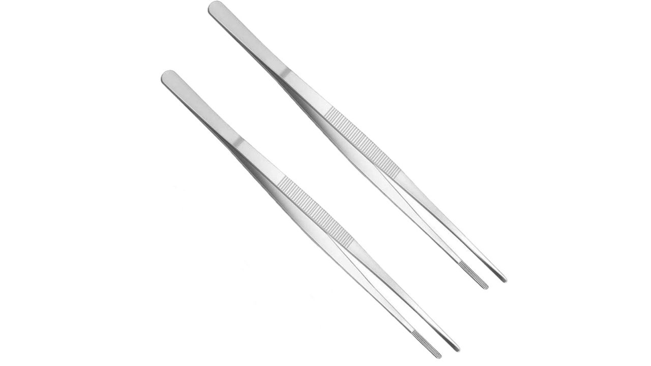 Two silver kitchen tongs against white background.