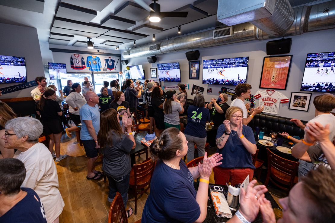 People cheer on the Minnesota Lynx to victory over the New York Liberty during a Coinbase WNBA Commissioner's Cup Finals Watch Party at A Bar Of Their Own in Minneapolis on June 25.