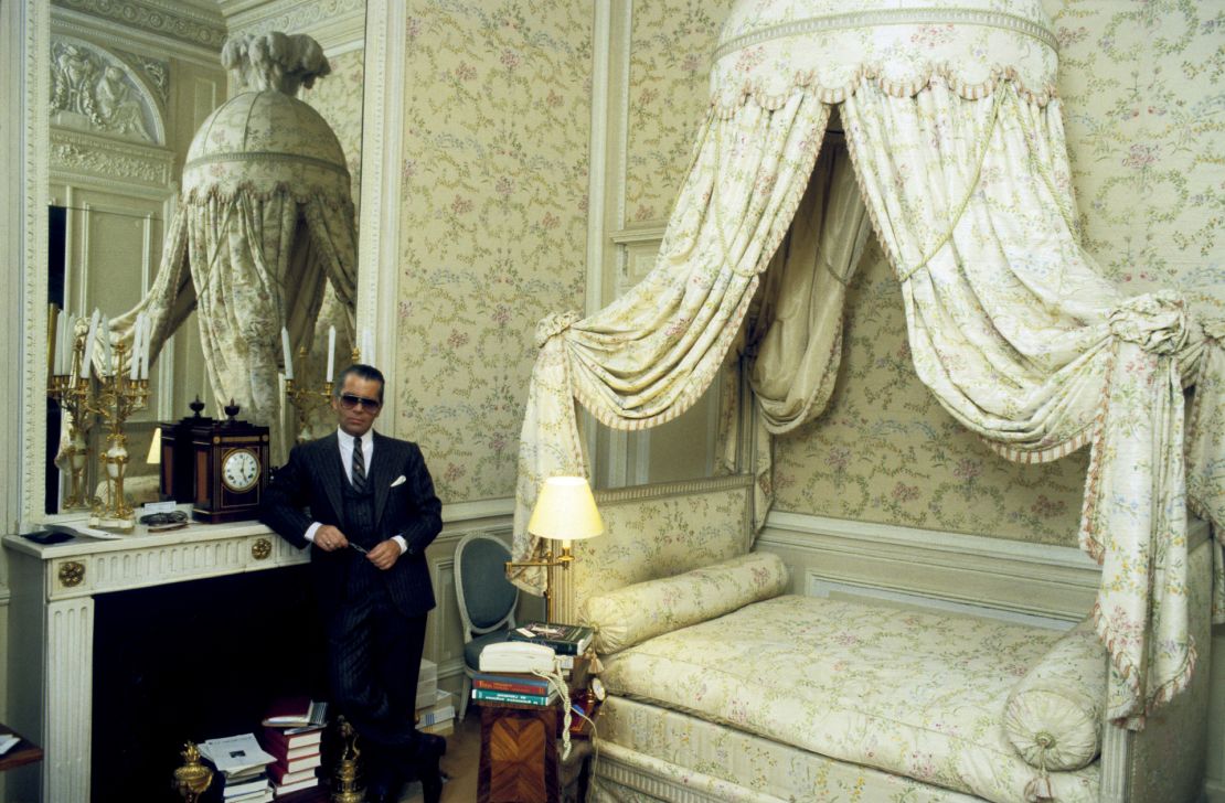 Lagerfeld in a bedroom at Villa La Vigie, his then-home in Roquebrune-Cap-Martin, southern France, in 1984 — the piles of books a nod to his love of reading, and a corded phone emblematic as a sign of the times (and, perhaps, an outlier, given the broader Regency-inspired theme).