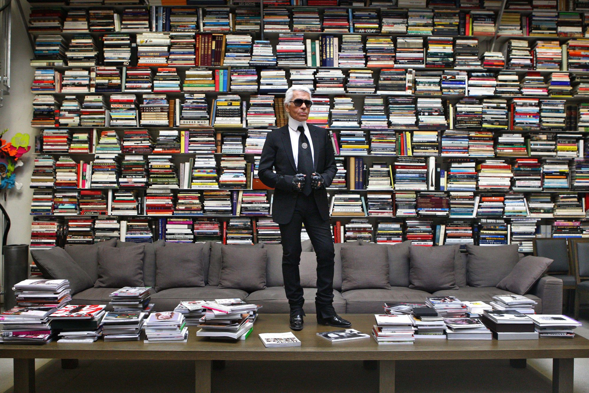 Karl Lagerfeld poses in his book-filled apartment and studio on Rue de Lille in Paris, France on November 12, 2008.
