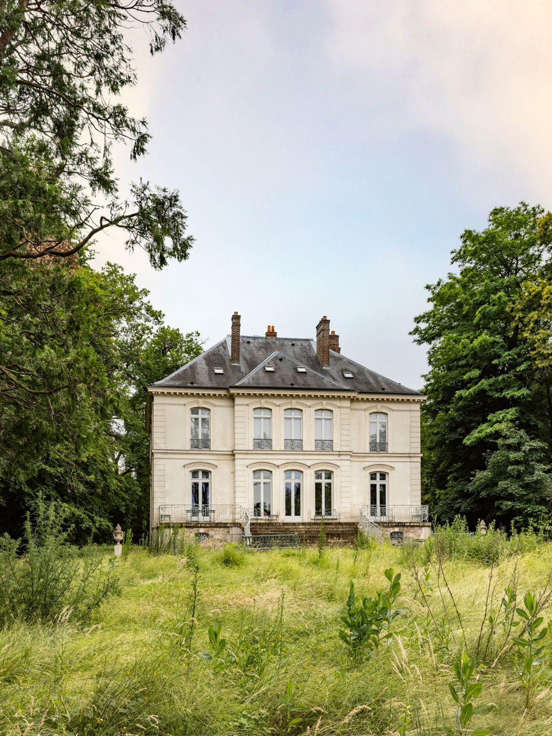 The neoclassical Pavillon de Voisins, an escape in the country which Lagerfeld christened the "Villa Louveciennes," was built in the mid-19th century. Lagerfeld purchased the home in 2009.