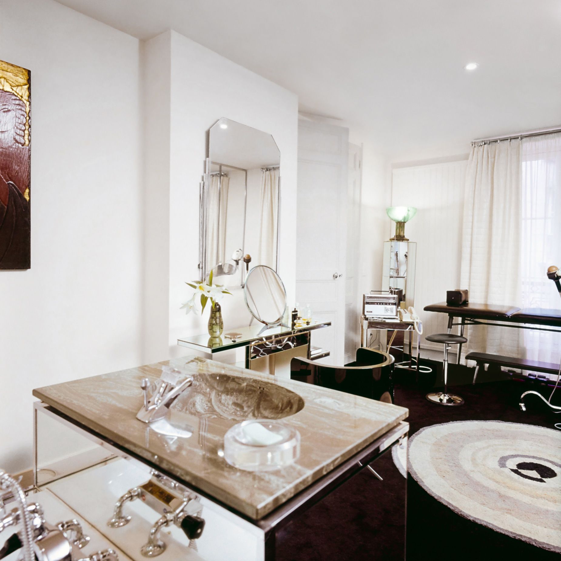 Lagerfeld designed the apartment's bathroom himself, focused on the balance of mirror and grey marble.