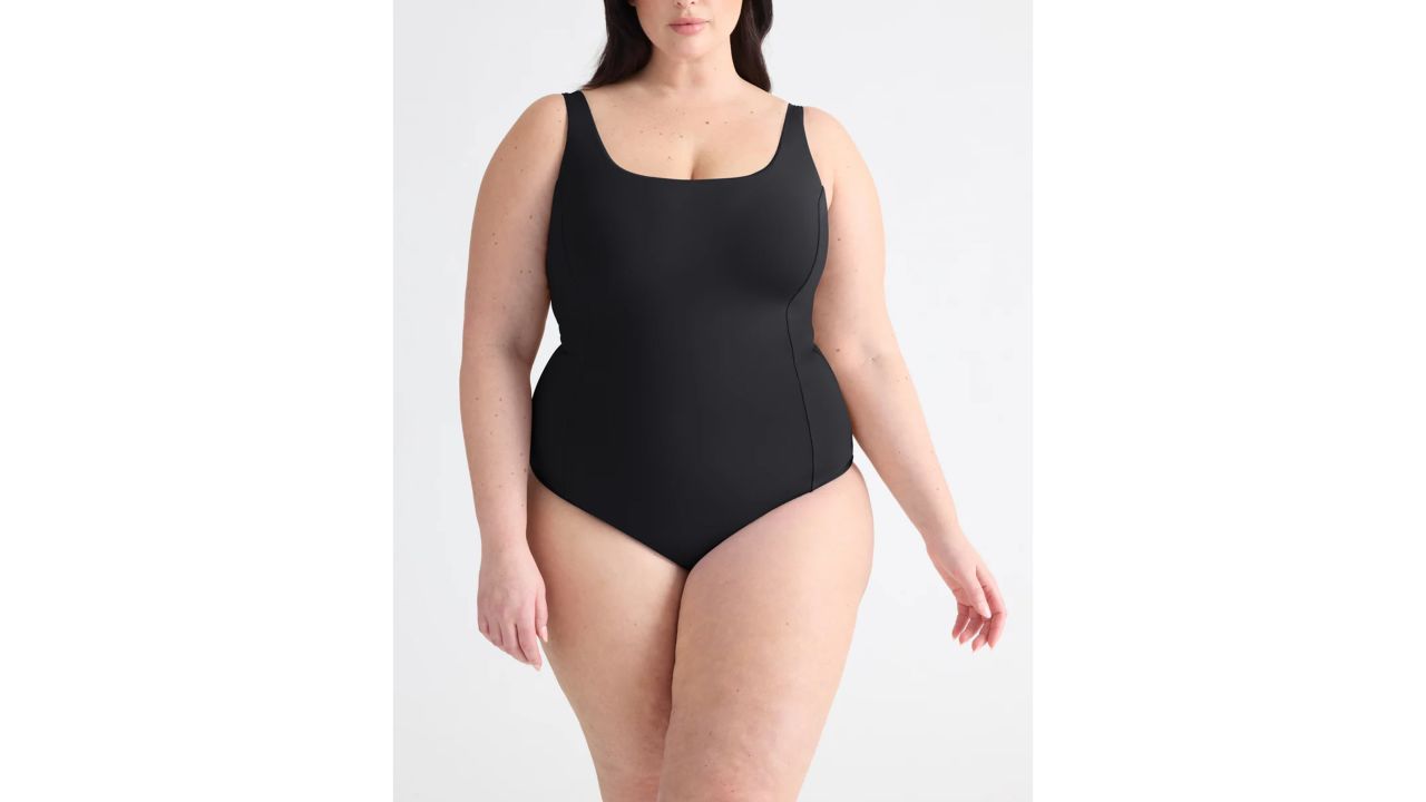 Woman wearing Knix Cinch Leakproof Shaper One-Piece Swimsuit in black