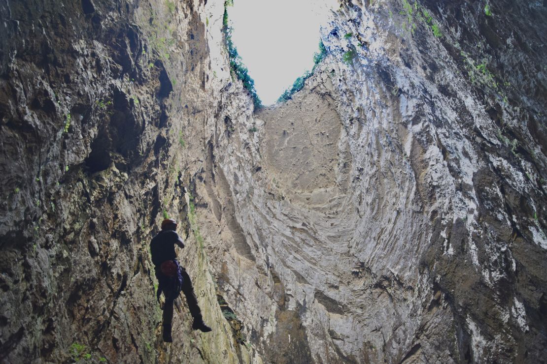 Miguel Galarraga of Corazon de Xoconostle Tours descends into a sinkhole known as Sotano de las Huahuas.