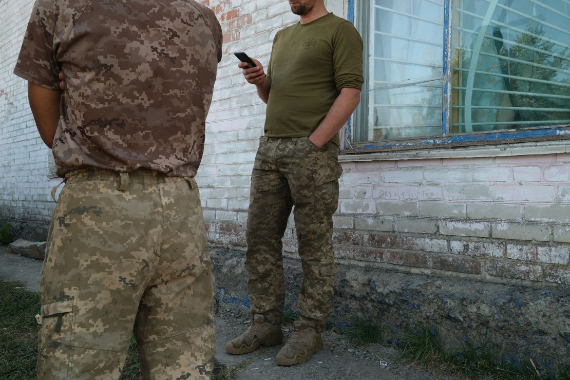 A group of Ukrainian soldiers rest in a village near the Russian border after taking part in Ukraine’s operation in Kursk. 