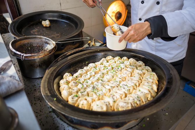 <strong>8. Shanghai, China</strong>: Pan-fried dumplings are an essential delicacy to try on a trip to Shanghai.