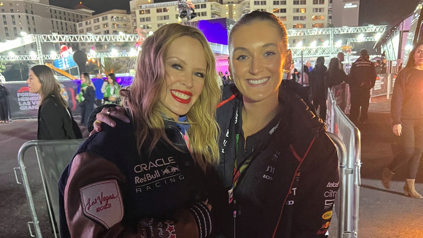 Red Bull's Jodie Porter, posing with Kylie Minogue, is responsible for guiding VIPs around the grid ahead of F1 races.