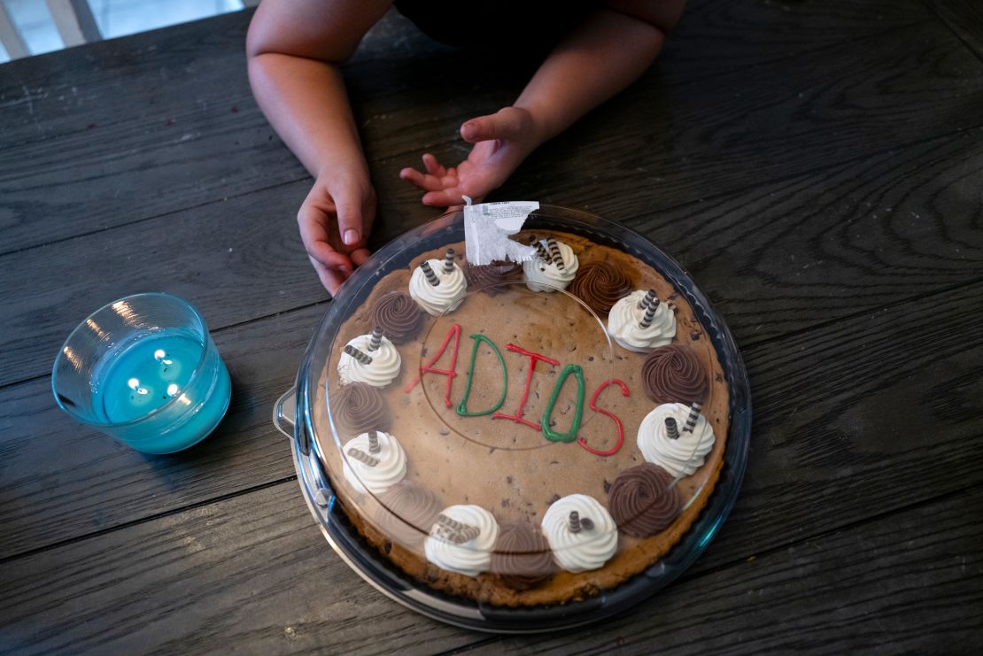 Graycen Mendoza waits to open up a cookie cake that reads,