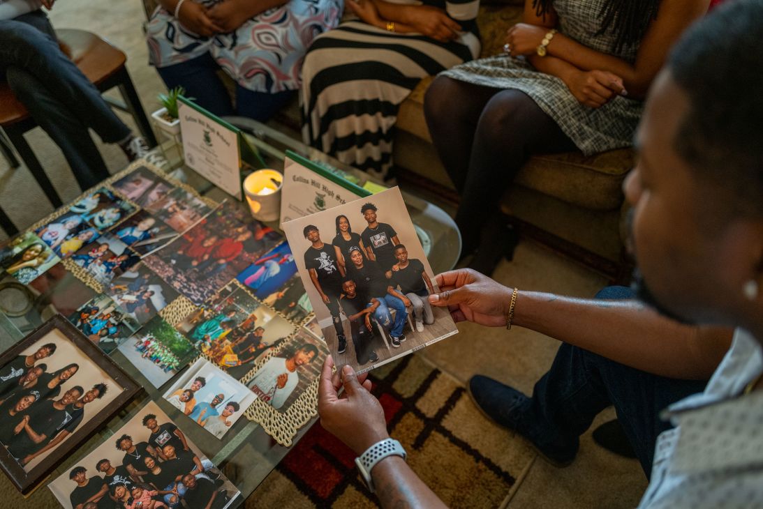Rahim Brawner holds a family photo in Lithonia, Georgia, on May 10, 2025.