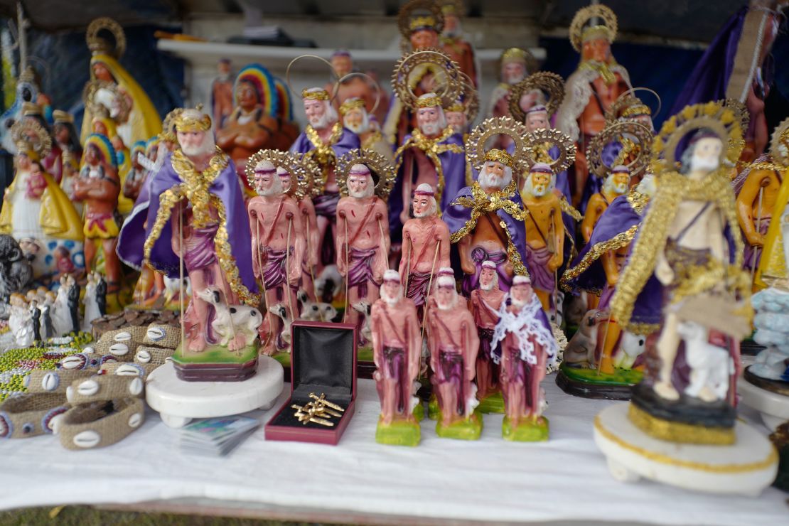 Statues of St. Lazarus are sold outside El Rincón church during the pilgrimage.