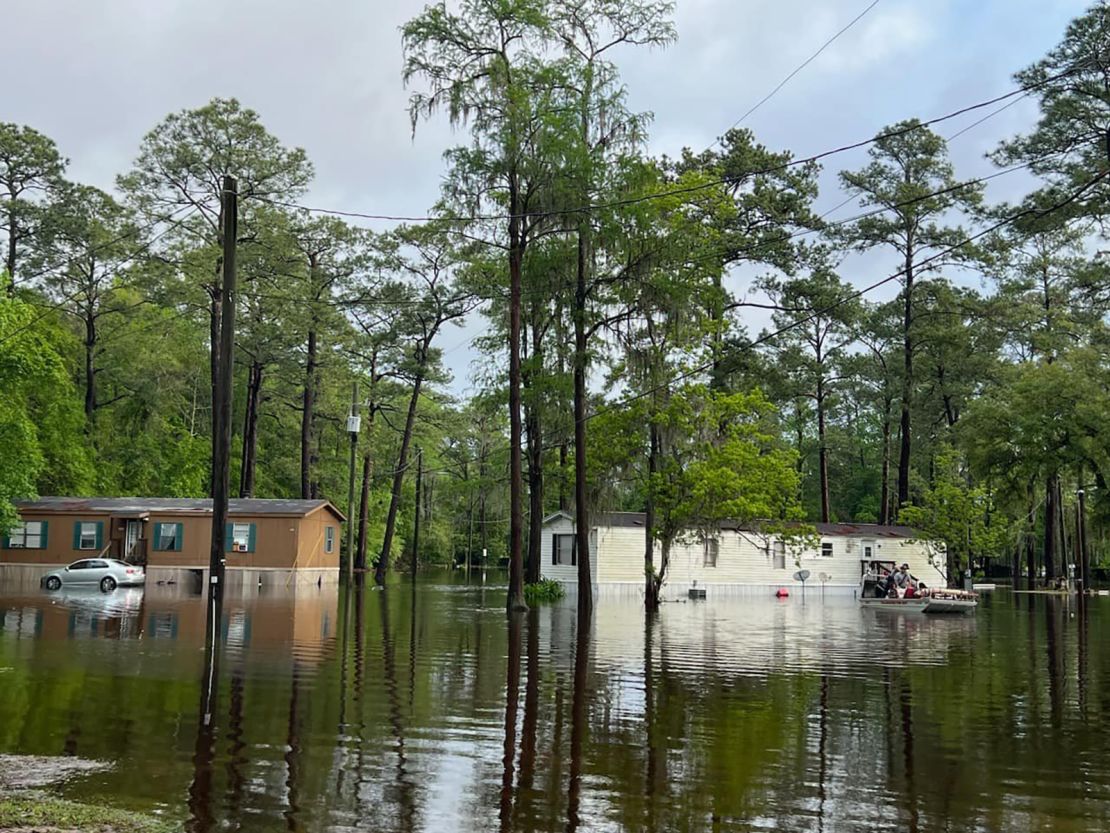 Floodwaters inundate a neighborhood as first responders rescue residents trapped in a mobile home in Tallahassee, Florida, Thursday morning.