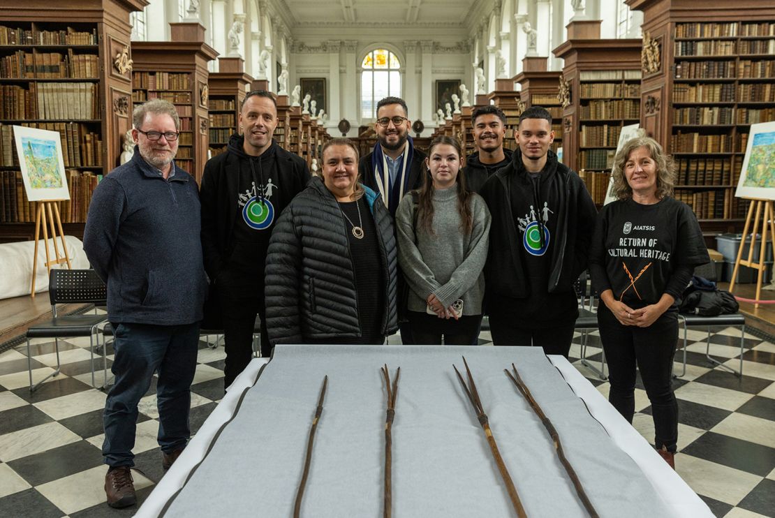 The spears pictured with a number of those involved in their repatriation.