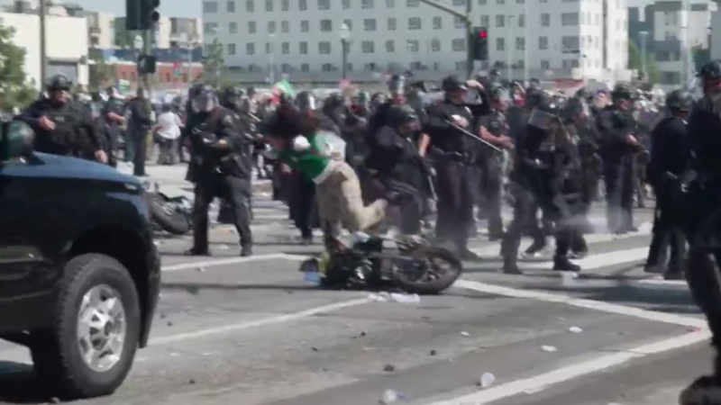 https://media.cnn.com/api/v1/images/stellar/prod/la-protest-motorcycle-crash.png?c=16x9&q=w_800,c_fill