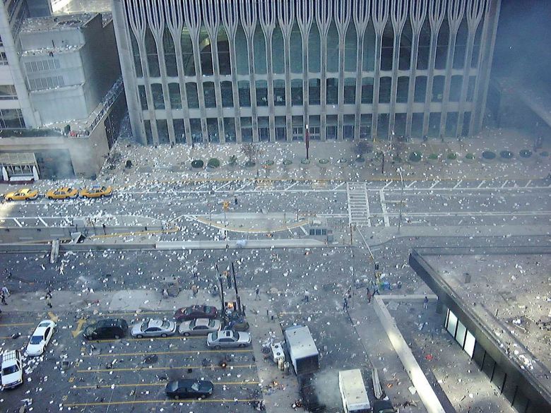 Laszlo Kiss snapped this image of the debris-littered street at the entrance to the South Tower after the first impact, which was at the neighboring North Tower.