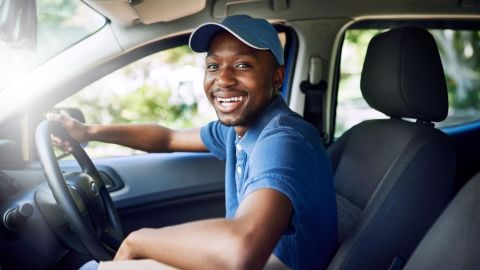 Delivery driver sitting in the driver’s seat.