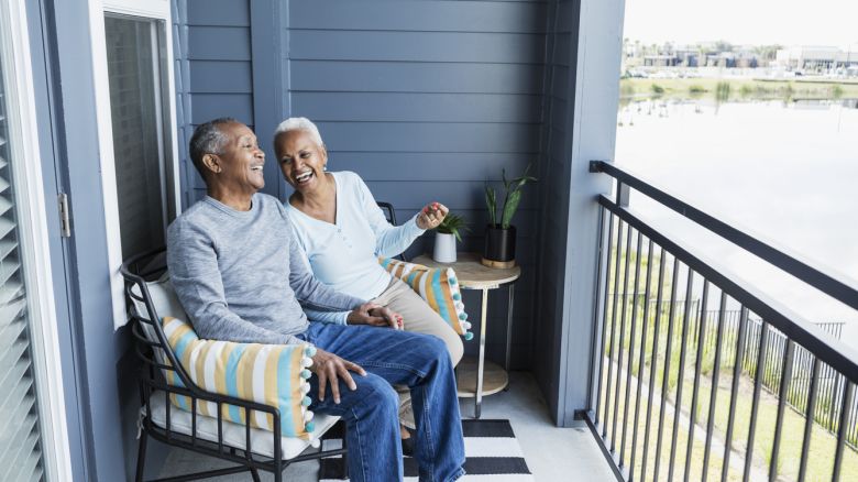 Condo owners enjoy the view from their balcony.