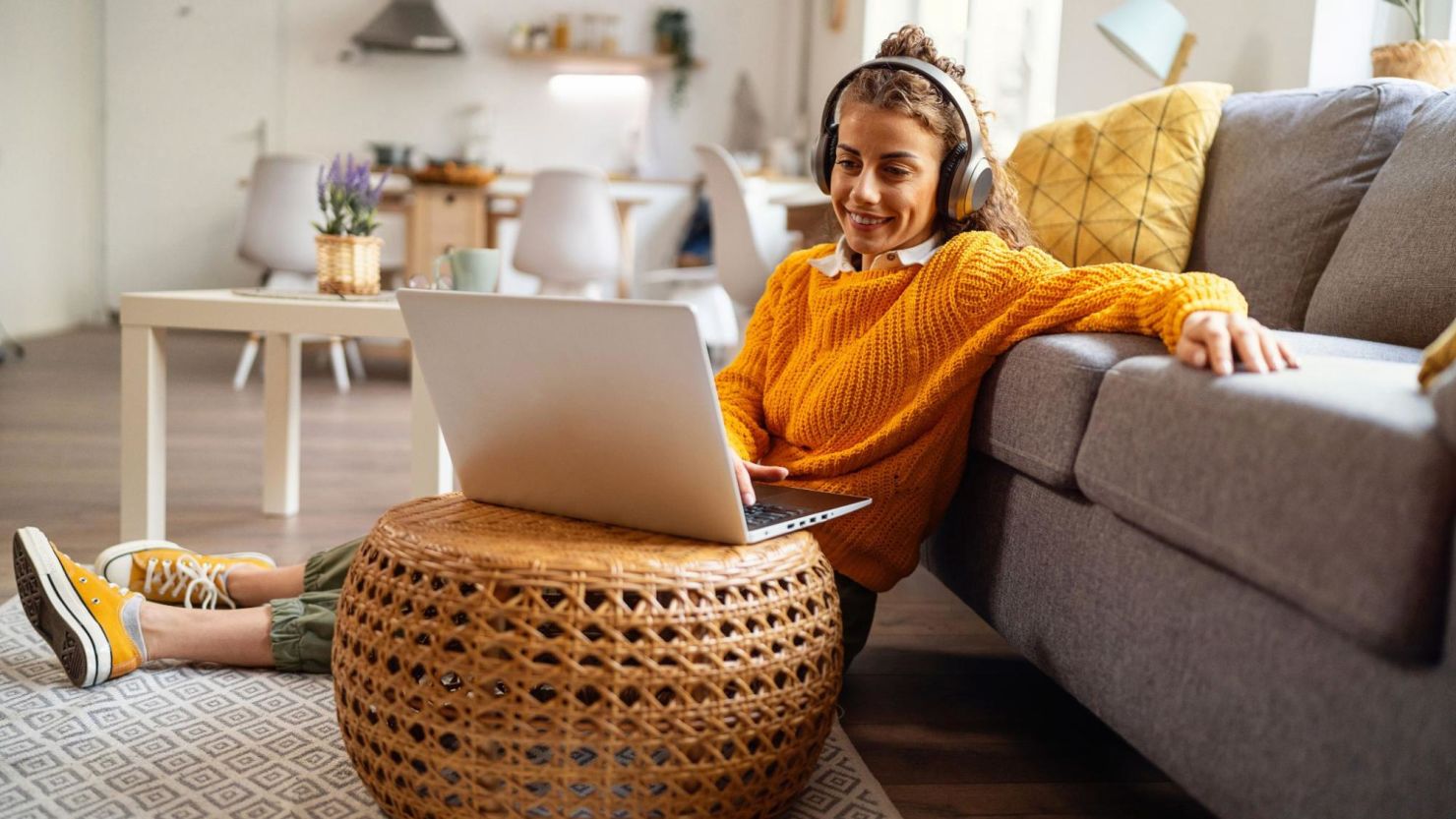 Person using their computer in their living room.