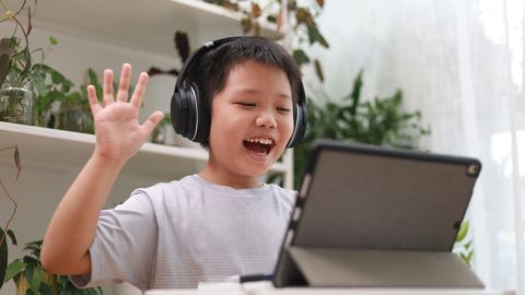 Child playing on an iPad.