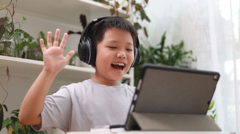 Child playing on an iPad.