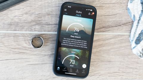 The Oura Ring and its companion app displayed on a phone.