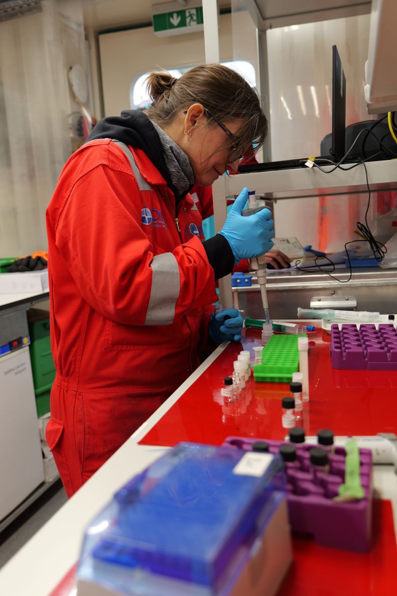 A scientist analyzes samples brought up from beneath the Atlantic Ocean.