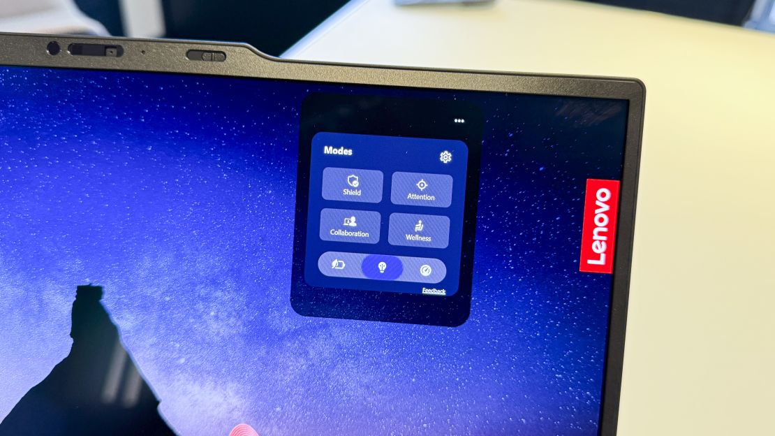 A close-up of the Lenovo Yoga 7 Slim 7i's Smart Modes menu shows buttons for Shield, Attention, Collaboration, and Wellness