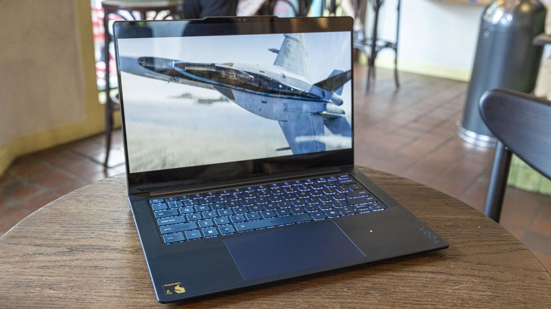 A jet plane in Top Gun: Maverick flies on the screen of the Lenovo Yoga Slim 7x