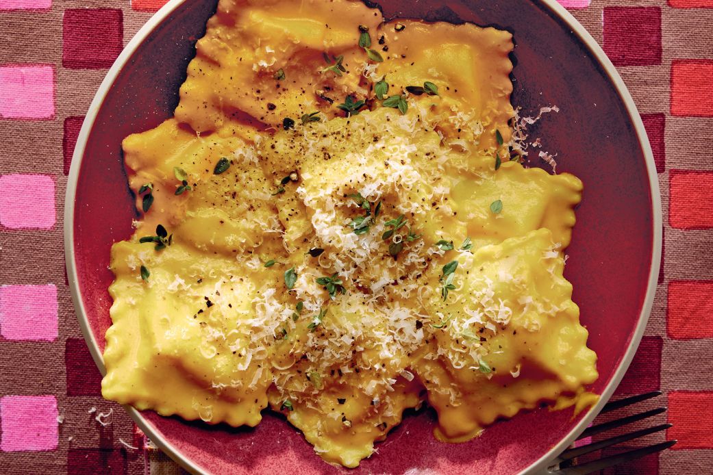 Author Dan Pelosi tops ravioli with a creamy pumpkin sauce in his new cookbook.