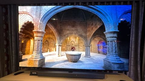 The LG C4 OLED TV presents a fantasy show in a darkened showroom.