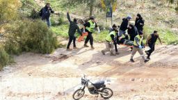 Rescuers in Chaqra carry an injured person shot by Israeli soldiers after he allegedly tried to walk toward Mais al-Jabal in southern Lebanon on January 26, 2025. The Lebanese army said Suon January 25 that Israeli fire killed one of its soldiers in the south of the country, where hundreds of residents were trying to return to their homes on the deadline for Israel to withdraw. (Photo by Mahmoud ZAYYAT / AFP) (Photo by MAHMOUD ZAYYAT/AFP via Getty Images)