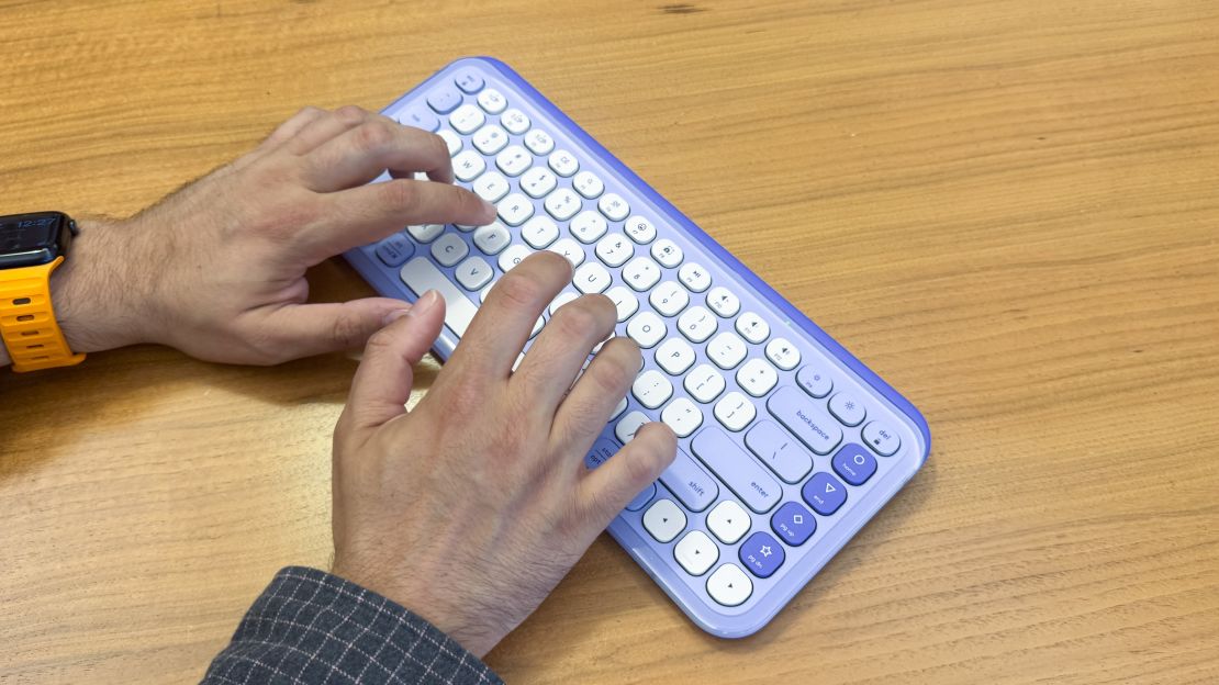 Someone typing on the Logitech Pop Icon Keys keyboard at an angle