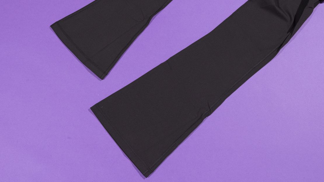 Bottom of leggings showing the hem with purple background.