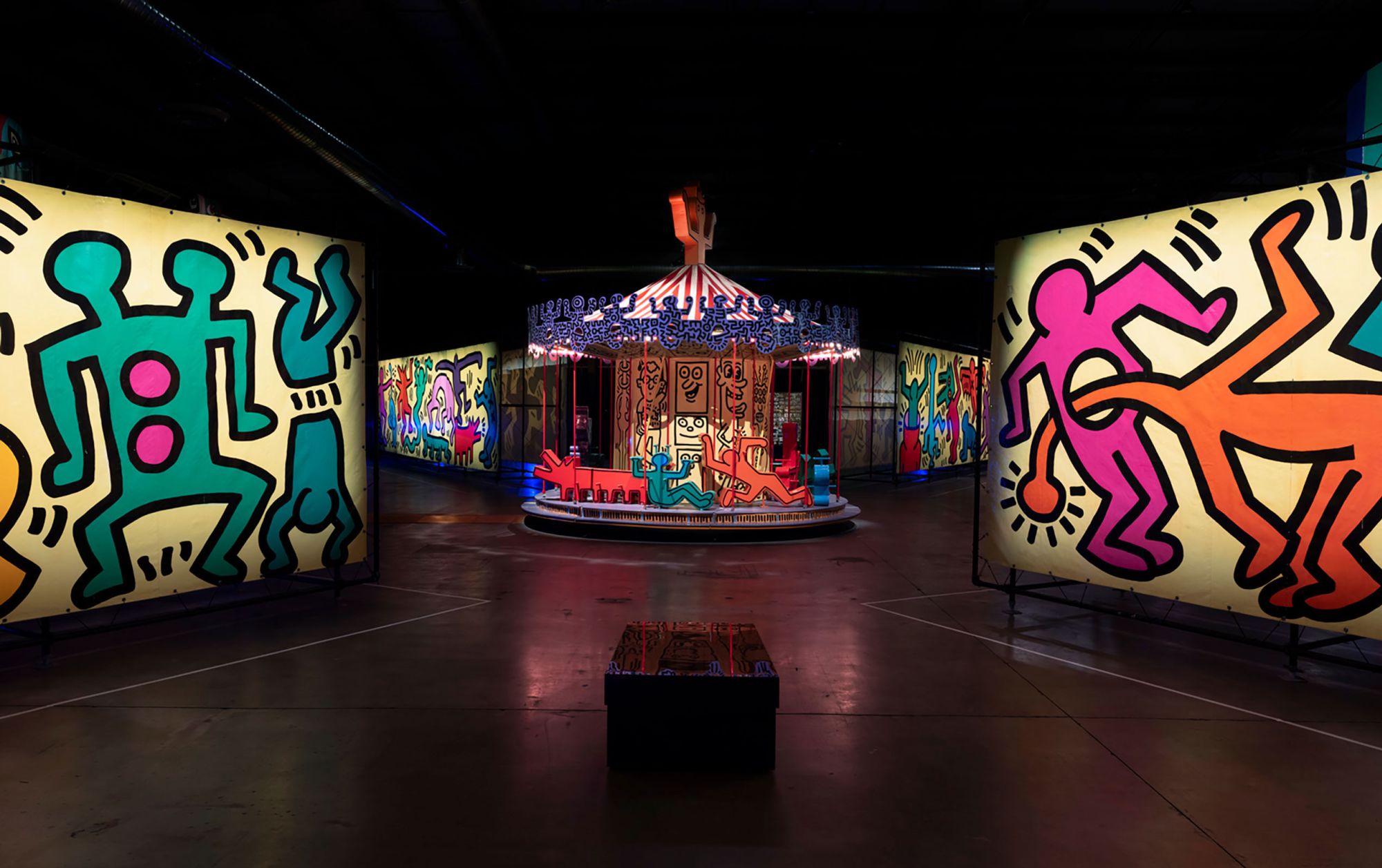 A Keith Haring-designer carousel (with the artist's signature figures replacing the ride's traditional horses) and accompanying murals pictured at "Luna Luna: Forgotten Fantasy."
