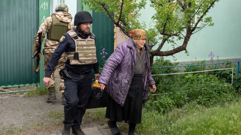  Maria, 85, evacuates the Ukrainian town of Vovchansk.