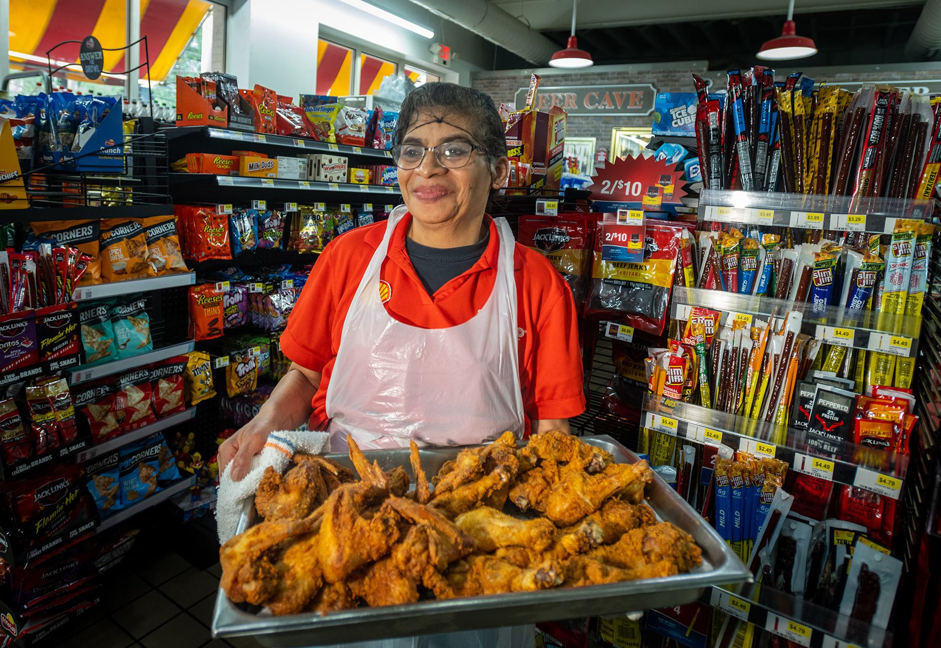 At Market Express, formerly Quik Shoppe, in Charlotte, Carolina, Medley photographed Marta Miranda, who had been frying chicken for 18 years.