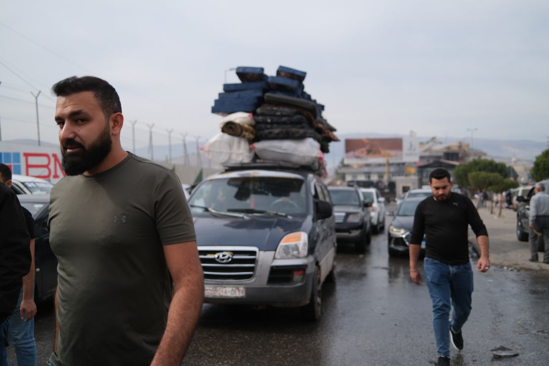 People cross from Syria into Lebanon at the Masnaa border crossing on Wednesday, December 11.